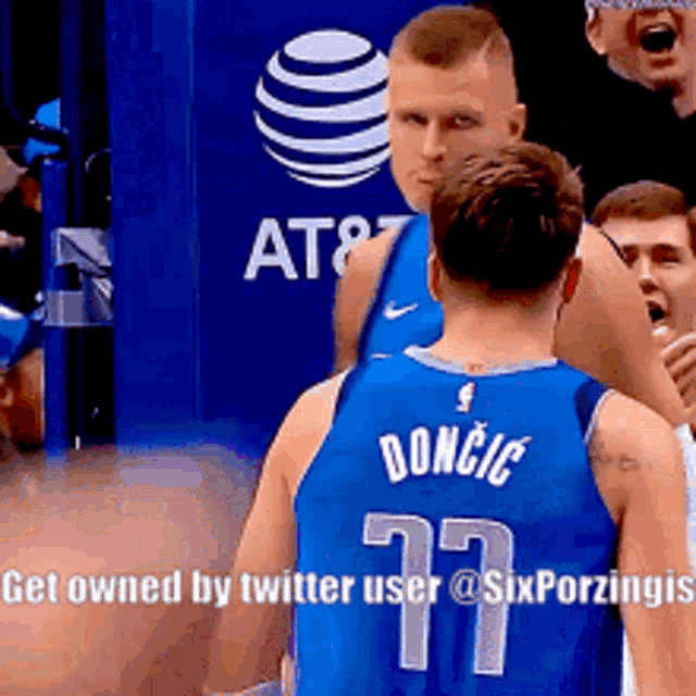 a basketball player with the number 77 on his back
