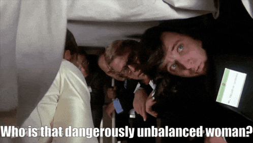 a group of people standing in a line with the words who is that dangerously unbalanced woman below them