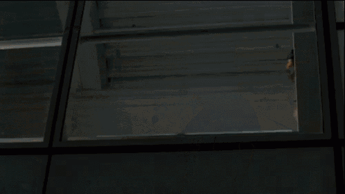 a group of people are standing on a balcony with stairs