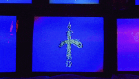 a cross is displayed on a blue and purple screen