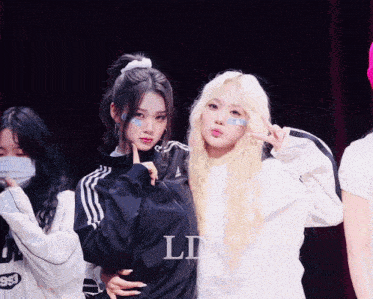 a group of girls posing for a photo with the letters ld on the bottom right