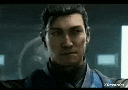 a close up of a man 's face in a video game looking at the camera .