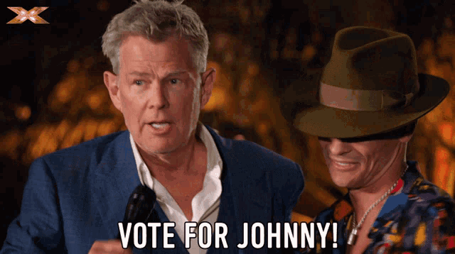 a man holding a microphone next to another man that says vote for johnny