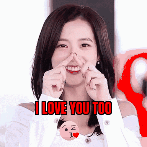 a woman making a heart shape with her fingers and the words i love you too