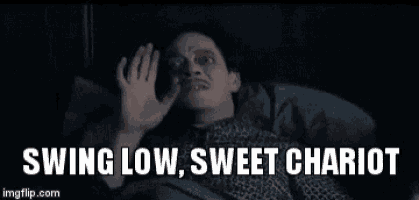 a man is laying in bed with his hand up and the words `` swing low , sweet chariot '' above him .