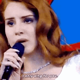 a woman singing into a microphone with the words " i only sing for you " below her