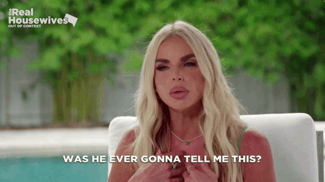 a woman is sitting in front of a pool with the words was he ever gonna tell me this
