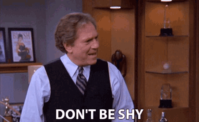 a man says do n't be shy in front of a trophy case