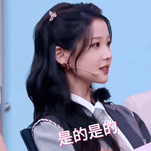 a girl with a microphone in her hair has chinese writing on her face