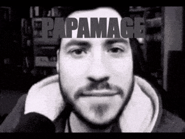a man with a beard is smiling in a black and white photo with papamace written on the top