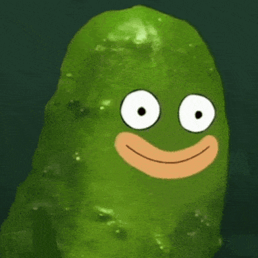 a green pickle with a cartoon face on it 's face .
