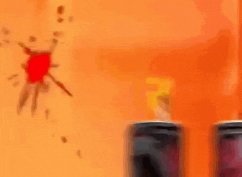 a person in a mask is sitting on top of a can of soda .