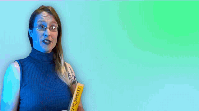 a woman is holding a book that says jk rowling