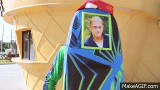 a giant ice cream cone with a picture of a man on it