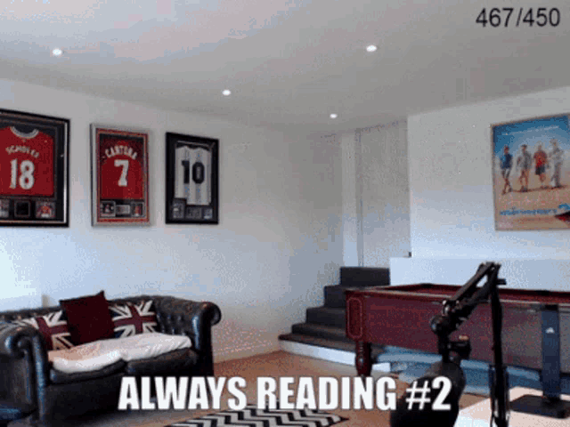 a living room with a couch and a pool table with always reading # 2 written on the bottom