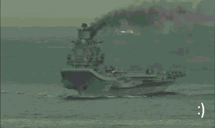 a large ship in the ocean with smoke coming out of the chimney