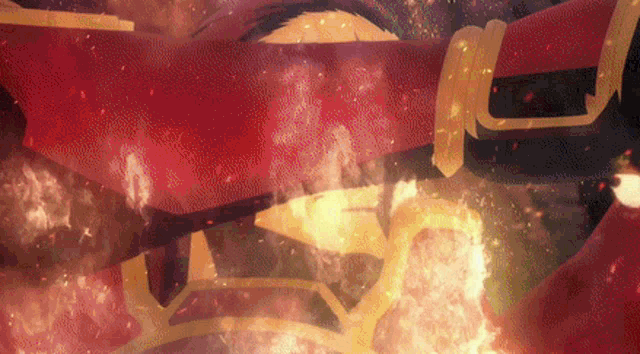 a close up of a person 's face with a red cape on