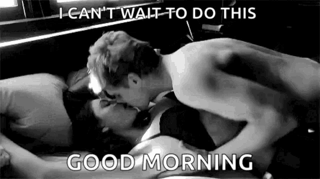 a man and a woman are kissing on a bed with a good morning message .