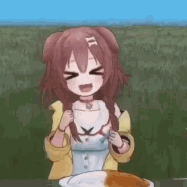 a girl is sitting at a table with a plate of food .