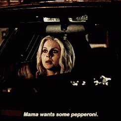 a woman is driving a car with the words mama wants some pepperoni