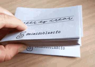 a person is holding a stack of business cards with the name mimidoblascfo on it