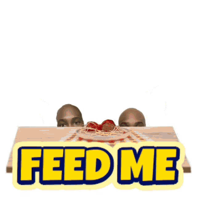 two men sit at a table with a plate of spaghetti and the words feed me