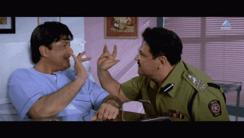 a man in a police uniform talks to another man