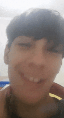 a close up of a person 's face with a blurred background .