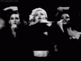 a black and white photo of a woman with the word vogue written on the bottom
