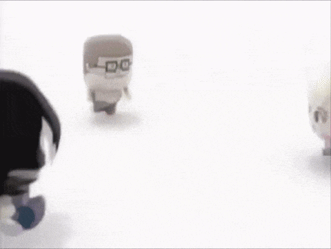 a group of cartoon characters are walking on a white surface .