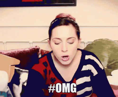 a woman in a striped sweater says #omg in front of her face