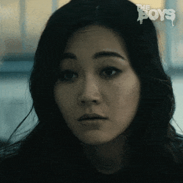 a close up of a woman 's face with the words " the boys " on the bottom