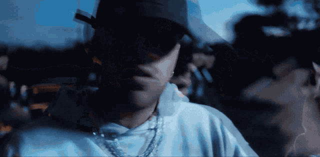 a close up of a person wearing a hat