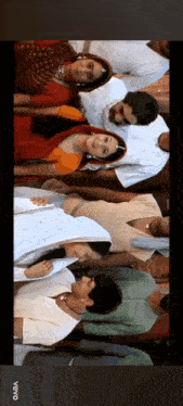 a group of people standing next to each other with the word vevo on the bottom left