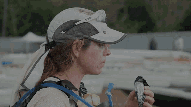 a woman wearing a hat that says uvex