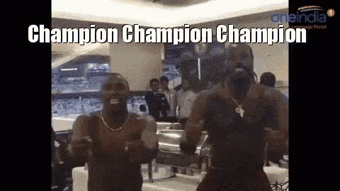 two men are dancing in a room with the words champion champion champion written on the bottom