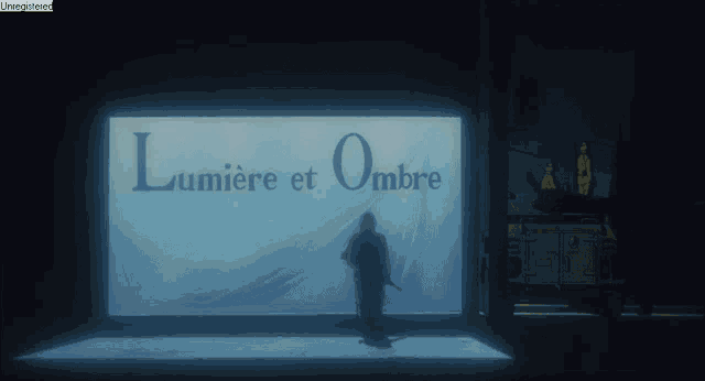 a man is standing in front of a large sign that says lumiere et ombre
