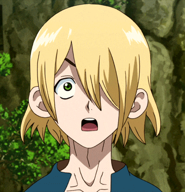 a close up of a person 's face with a surprised look on their face