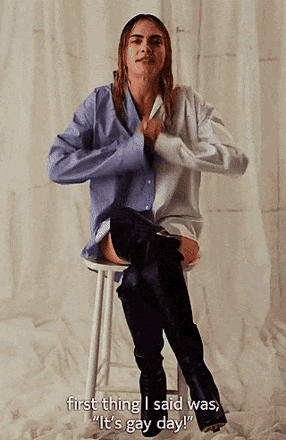 a woman is sitting on a stool and saying " first thing i said was "