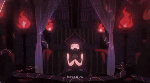 a girl is sitting on a throne in a dark room with candles and a purple curtain .