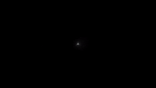 a mercedes logo is lit up on a black background