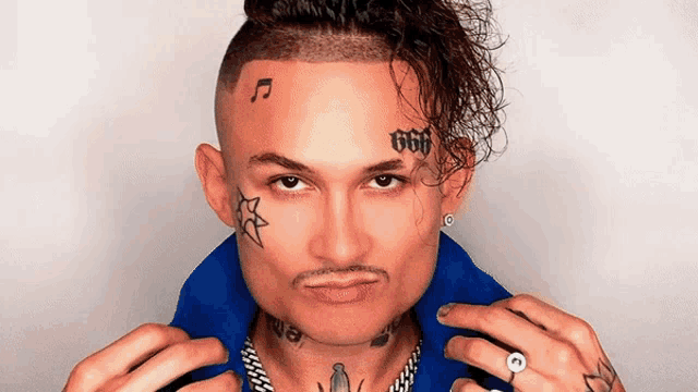 a man with a tattoo on his face that says 666 on it