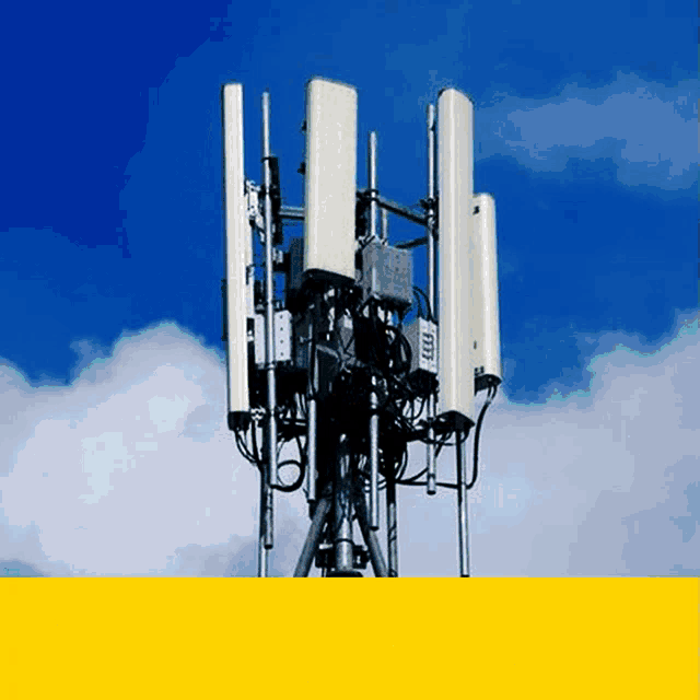 a tower with a blue sky in the background and a yellow border