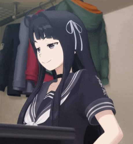 a girl with long black hair is standing in front of a rack of clothes