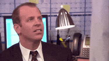 a man in a suit and tie is looking up