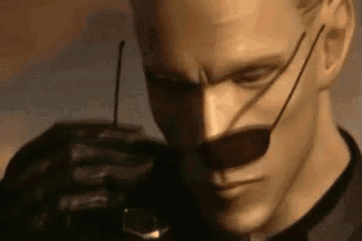 a close up of a man wearing sunglasses and holding a gun .