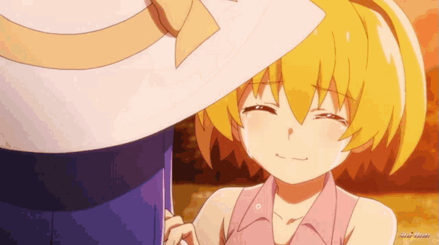 a girl with yellow hair is crying while a man holds her hand