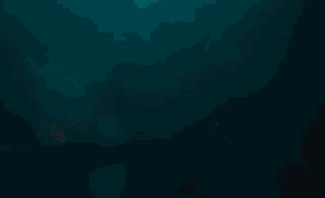 a close up of a monster in the water with its mouth wide open