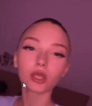 a close up of a woman 's face with a arrow pointing to her mouth