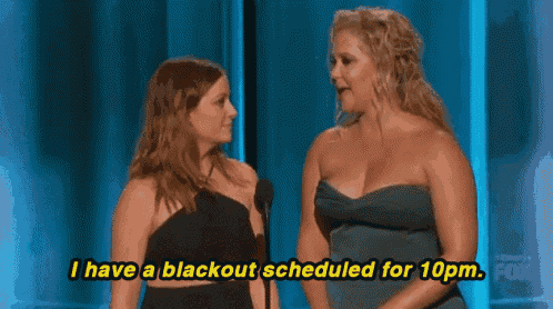 two women are standing next to each other and one of them says i have a blackout scheduled for 10pm .